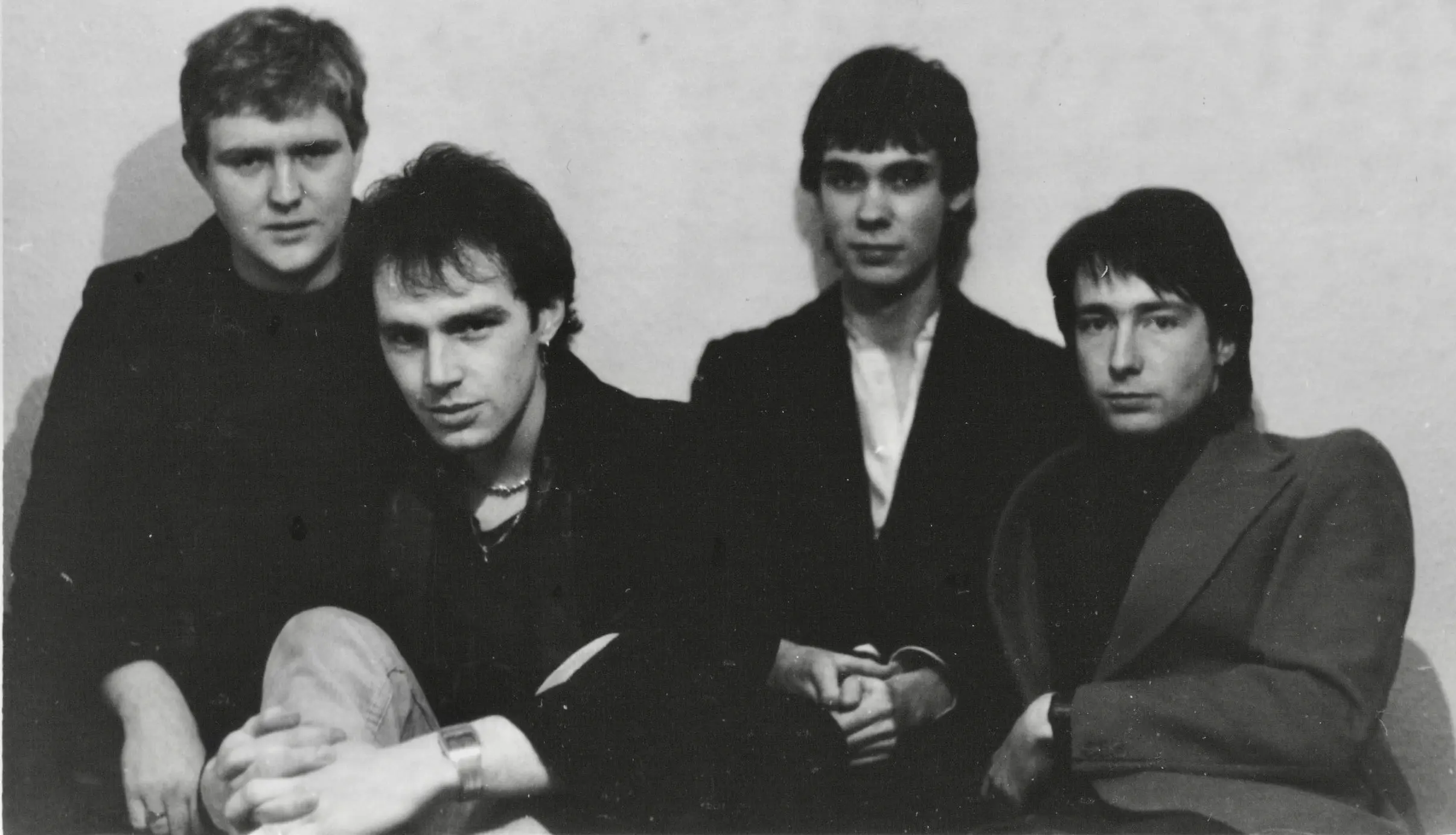 A black and white promotional picture of the band Red Line